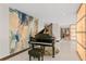 Elegant foyer featuring a grand piano, stunning marble accent wall, porcelain tile floor and ambient lighting at 3301 Bayshore Blvd # 2401E, Tampa, FL 33629
