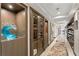 Hallway with custom built-in storage and display cabinets, and decorative rug runner at 3301 Bayshore Blvd # 2401E, Tampa, FL 33629