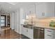 Modern kitchen with stainless steel appliances and stylish backsplash at 3301 Bayshore Blvd # 2401E, Tampa, FL 33629