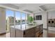 The kitchen includes an island with granite countertops, stainless steel appliances and floor to ceiling windows at 3301 Bayshore Blvd # 2401E, Tampa, FL 33629