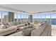 Bright living room featuring large windows and panoramic waterfront views at 3301 Bayshore Blvd # 2401E, Tampa, FL 33629