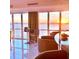 Living space with panoramic water views framed by expansive windows and comfortable seating at 3301 Bayshore Blvd # 2401E, Tampa, FL 33629