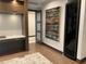 Office space featuring built-in shelving, a desk and large art, plus bonus beverage cooler at 3301 Bayshore Blvd # 2401E, Tampa, FL 33629