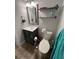 Updated bathroom with a modern vanity, mirror and shelving for ample storage at 333 Island Way # 203, Clearwater Beach, FL 33767