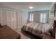 Serene bedroom with neutral colors, plantation shutters, ample closet space, and natural light at 333 Island Way # 203, Clearwater Beach, FL 33767