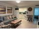 Cozy living room with a sofa, chair, and a view of the kitchen, creating an inviting living space at 333 Island Way # 203, Clearwater Beach, FL 33767