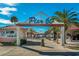 Entrance to Pier 60 with shops and activity on a sunny day at 333 Island Way # 203, Clearwater Beach, FL 33767