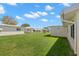 Exterior of the home featuring a well-manicured lawn and white walls at 3545 97Th N Ave # 4, Pinellas Park, FL 33782