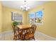 The dining area features a wood table and views of the outdoors at 3545 97Th N Ave # 4, Pinellas Park, FL 33782