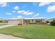Inviting single-story home with a well-kept lawn and an attached two-car garage at 3545 97Th N Ave # 4, Pinellas Park, FL 33782