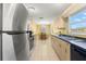Functional kitchen with stainless steel appliances, ample counter space, and a view of the dining area at 3545 97Th N Ave # 4, Pinellas Park, FL 33782