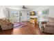 Cozy living room with hardwood floors, comfortable seating, and plenty of natural light at 3545 97Th N Ave # 4, Pinellas Park, FL 33782