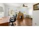 Home office space with natural light, wood floors, and a traditional roll-top desk at 3545 97Th N Ave # 4, Pinellas Park, FL 33782