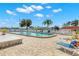 Community pool featuring lounge chairs, palm trees, and an open-air shelter at 3545 97Th N Ave # 4, Pinellas Park, FL 33782