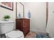 Cozy bathroom features a single sink vanity, tile floors, and a shower with tile surround at 3910 W Comanche Ave, Tampa, FL 33614