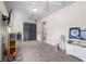 Large bedroom with carpet flooring, a ceiling fan, and access to an adjacent bathroom at 3910 W Comanche Ave, Tampa, FL 33614