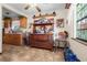 Cozy dining area with classic decor, a window seat, and cabinetry for displaying ornaments at 3910 W Comanche Ave, Tampa, FL 33614