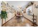 Inviting dining room with tile floors, bright windows, and decorative display shelves at 3910 W Comanche Ave, Tampa, FL 33614