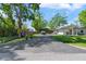 Long driveway with side landscaping leading to the home at 3910 W Comanche Ave, Tampa, FL 33614