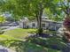 Charming single-story home with mature trees and well-manicured lawn at 3910 W Comanche Ave, Tampa, FL 33614