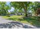 Lovely one-story home with mature trees and well-maintained lawn, a welcoming sight at 3910 W Comanche Ave, Tampa, FL 33614