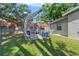 Backyard showing a greenhouse and gravel floor at 3910 W Comanche Ave, Tampa, FL 33614