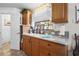 Bright kitchen with neutral counters, ample storage, decor, and natural light from the window at 3910 W Comanche Ave, Tampa, FL 33614