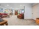 Inviting living room features wood-look flooring, recessed lighting, and a comfortable seating area at 3910 W Comanche Ave, Tampa, FL 33614