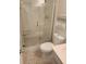 Bathroom featuring tiled shower and floor with white fixtures at 400 64Th Ave # 202, St Pete Beach, FL 33706