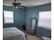 Bedroom featuring soft blue walls and plenty of natural light at 400 64Th Ave # 202, St Pete Beach, FL 33706