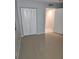 Bedroom closet with bi-fold doors and neutral carpet at 400 64Th Ave # 202, St Pete Beach, FL 33706