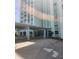 Exterior condo entrance featuring large awning and well maintained landscaping at 400 64Th Ave # 202, St Pete Beach, FL 33706