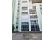 Condo exterior featuring multiple balconies and large sliding glass doors at 400 64Th Ave # 202, St Pete Beach, FL 33706