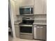 Modern kitchen with stainless steel appliances and granite countertops at 400 64Th Ave # 202, St Pete Beach, FL 33706