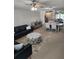 Bright living room with modern decor and an open layout to the kitchen and dining area at 400 64Th Ave # 202, St Pete Beach, FL 33706