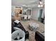 Spacious living room with modern furniture, adjacent to the dining area and kitchen at 400 64Th Ave # 202, St Pete Beach, FL 33706