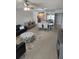 Open-concept living room with modern furniture and view into the kitchen at 400 64Th Ave # 202, St Pete Beach, FL 33706