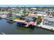 Waterfront property featuring a large screened-in pool, boat dock, and lift for convenient water access at 4011 99Th W St, Bradenton, FL 34210