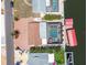 Aerial view showcases backyard pool, boat dock, and paver driveway, highlighting outdoor living spaces at 4011 99Th W St, Bradenton, FL 34210