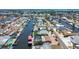 High aerial view showcases canal-lined streets, waterfront homes, and lush landscaping in a coastal community setting at 4011 99Th W St, Bradenton, FL 34210