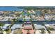 Aerial view of waterfront homes with canal access, featuring pools and boat docks, showcasing the coastal lifestyle at 4011 99Th W St, Bradenton, FL 34210