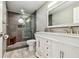 Updated bathroom featuring a glass enclosed shower, a marble vanity, and modern fixtures at 4011 99Th W St, Bradenton, FL 34210