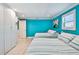 Bright bedroom with twin beds, and ample closet space, featuring blue walls and nautical accents at 4011 99Th W St, Bradenton, FL 34210