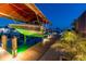 Modern boat lift with lights illuminating the dock at twilight at 4011 99Th W St, Bradenton, FL 34210