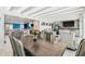 A view of the open-concept dining area with a table and seating, adjacent to the kitchen and living spaces at 4011 99Th W St, Bradenton, FL 34210