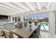 Bright dining area with a wooden table, seating for six, and scenic views of the pool and outdoor living space at 4011 99Th W St, Bradenton, FL 34210