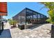 A beautiful home with an enclosed pool, stunning pavers, and lush landscaping near the waterway at 4011 99Th W St, Bradenton, FL 34210