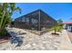 A beautiful home with an enclosed pool, stunning pavers, and lush landscaping near the waterway at 4011 99Th W St, Bradenton, FL 34210