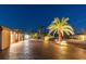 Beautiful one-story home exterior showcasing paver driveway, landscape lighting, and nighttime appeal at 4011 99Th W St, Bradenton, FL 34210