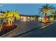 Beautiful one-story home exterior showcasing paver driveway, landscape lighting, and nighttime appeal at 4011 99Th W St, Bradenton, FL 34210
